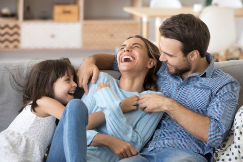 A happy family laughing together.