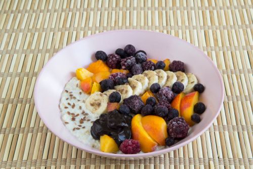 Bowl of oatmeal with fresh fruits for breakfast. 