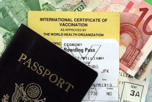 Passport next to an international certificate of vaccination. 