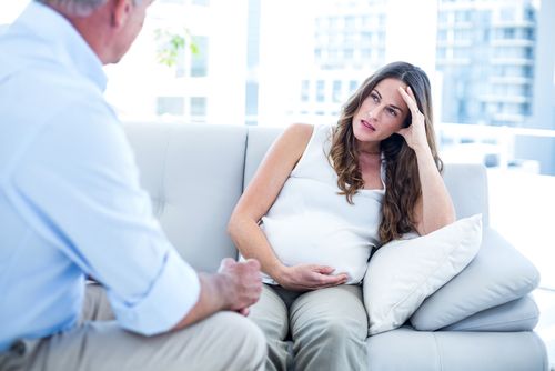 Pregnant woman getting therapy.