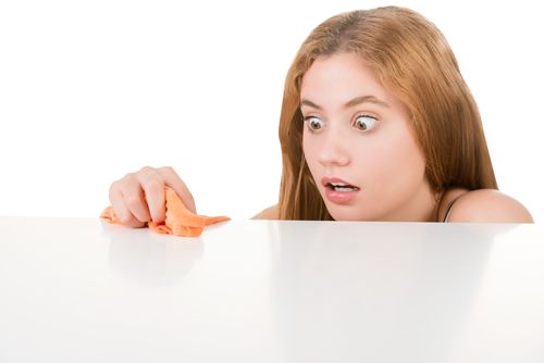 Woman with OCD cleaning the table.