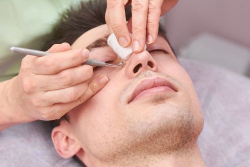 A man getting his blackheads extracted professionally. 